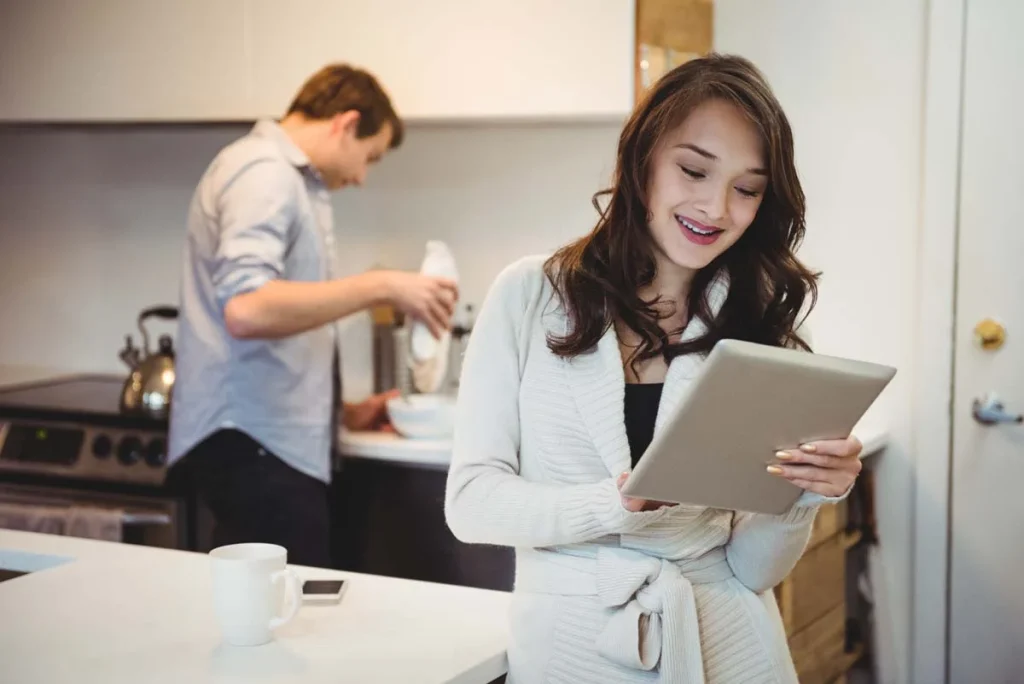 Homeowner selecting a custom residential cleaning schedule on a tablet