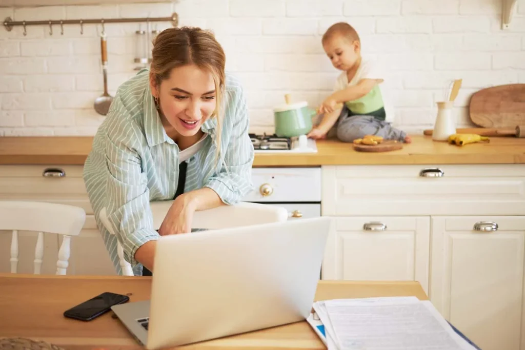 Person using a laptop in a tidy room to request a free cleaning quote